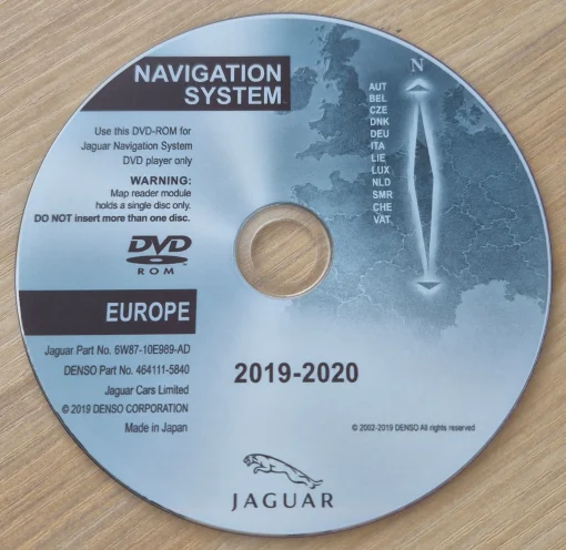 DVD-ROM labeled Navigation System Europe for Jaguar, showing a map and compass design on a silver disc.